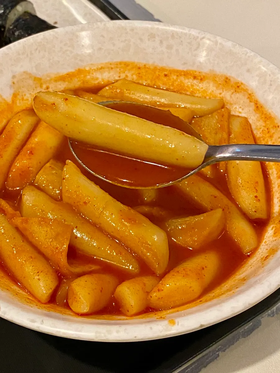 Wheat rice cake tteokbokki coated in fried batter flakes
