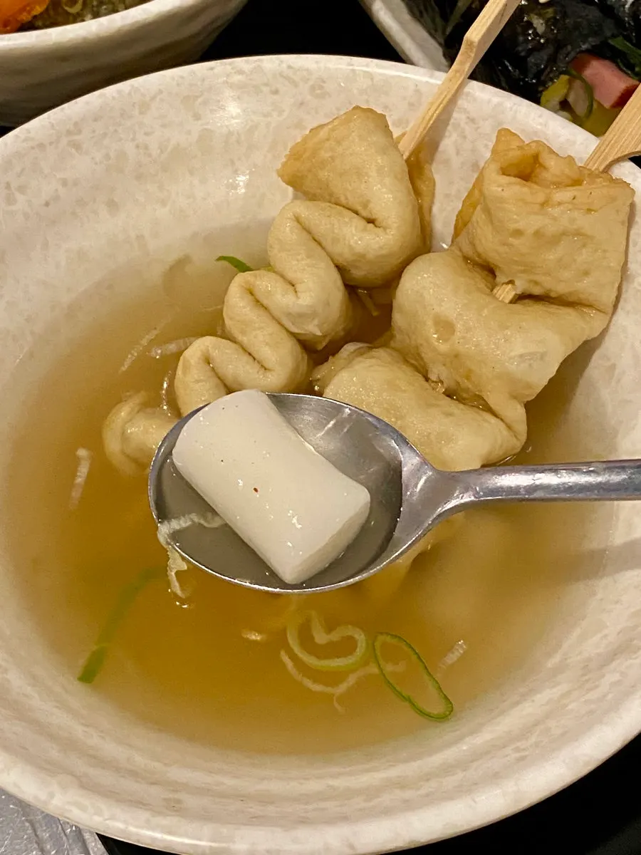 Rice cake hidden underneath the fish cake