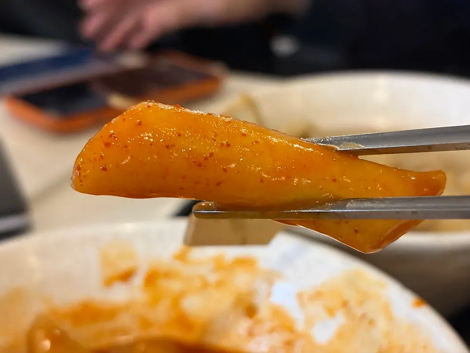 Rice cakes well coated in sauce