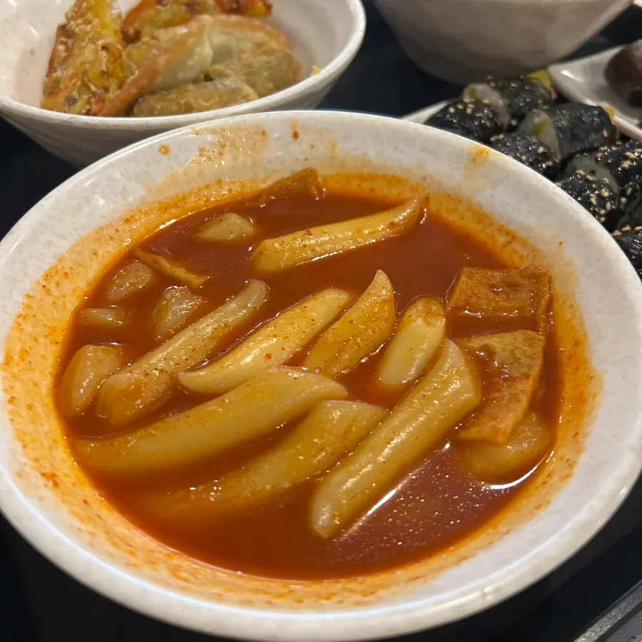 Table set with tteokbokki and side dishes