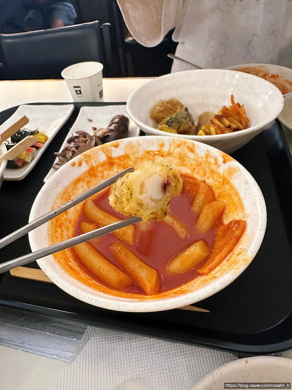 Tteokbokki coated in self-serve fried batter flakes