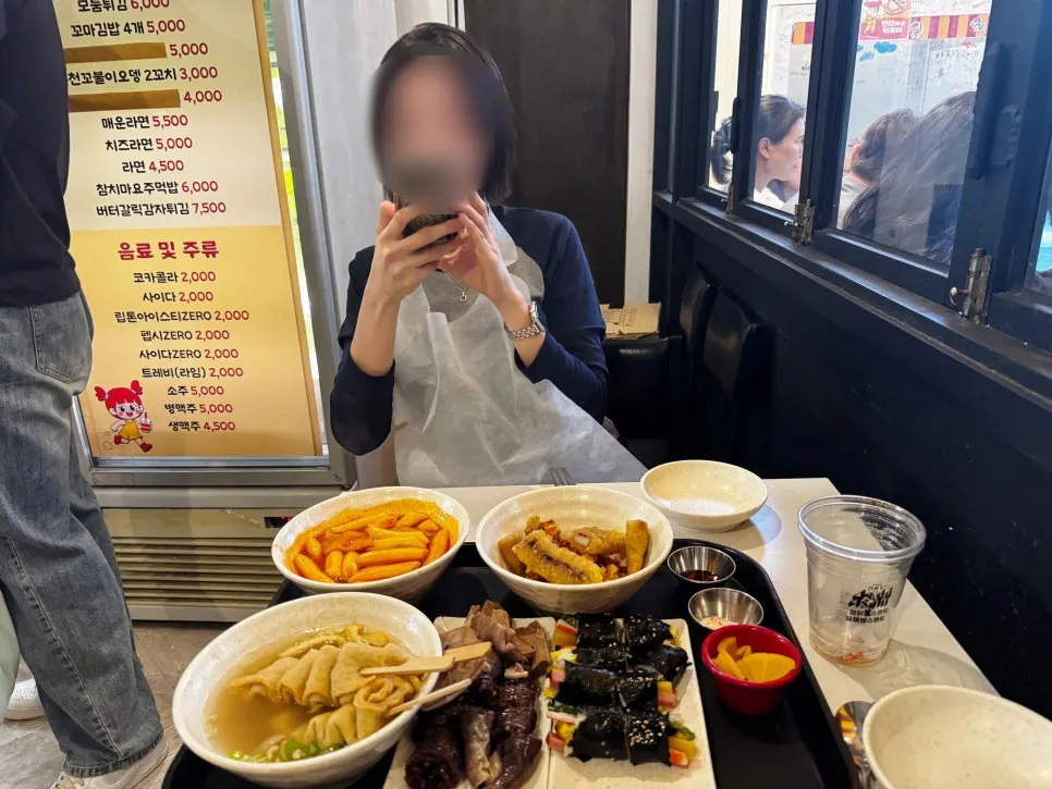A full spread of tteokbokki at Hyeonseonine Yongsan Main Branch