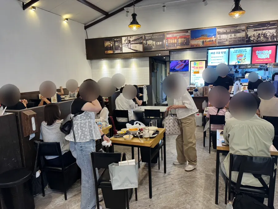 Interior split between freshly-made tteokbokki seating and regular seating