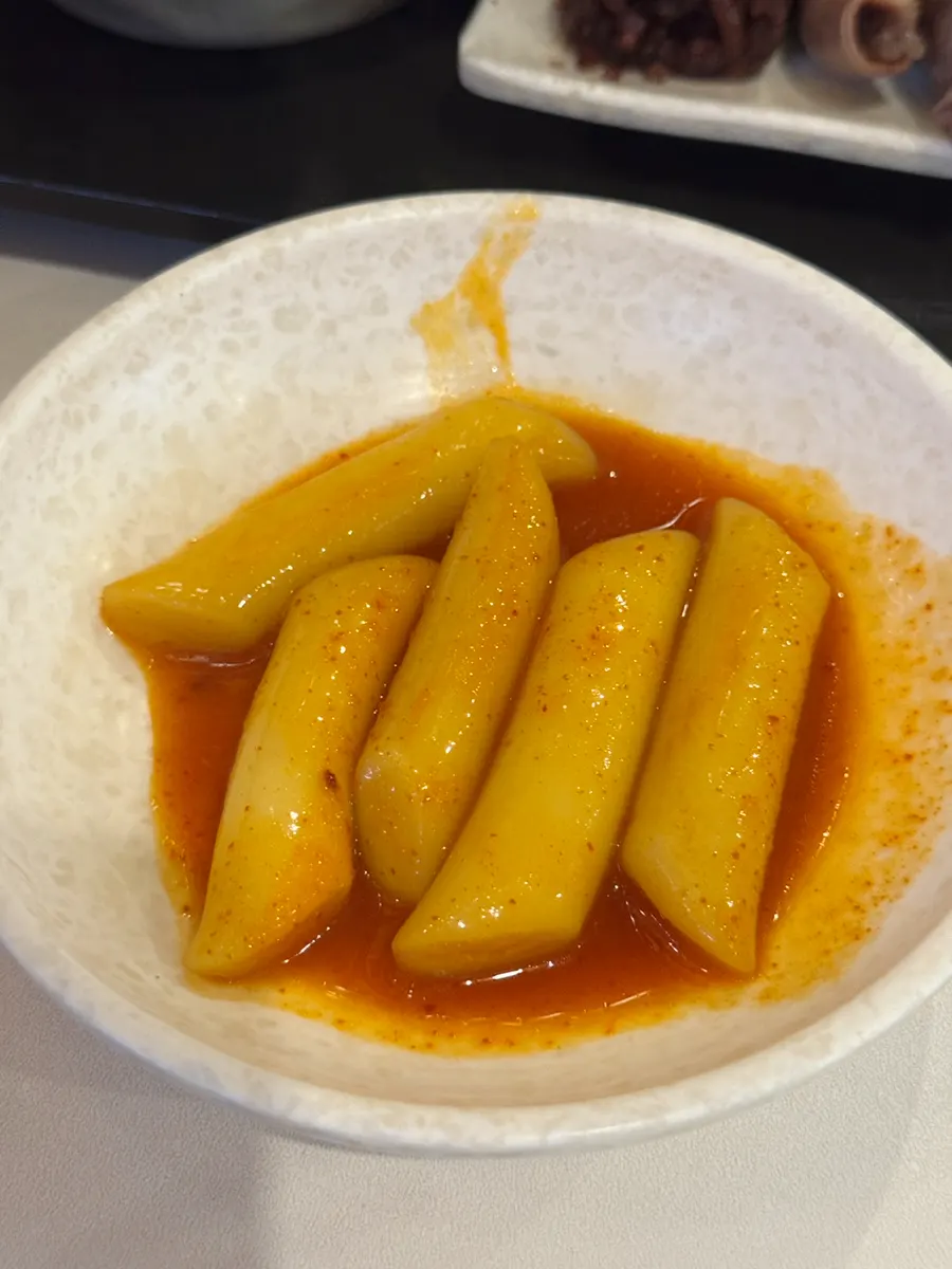 Leftover tteokbokki and side dishes on the table
