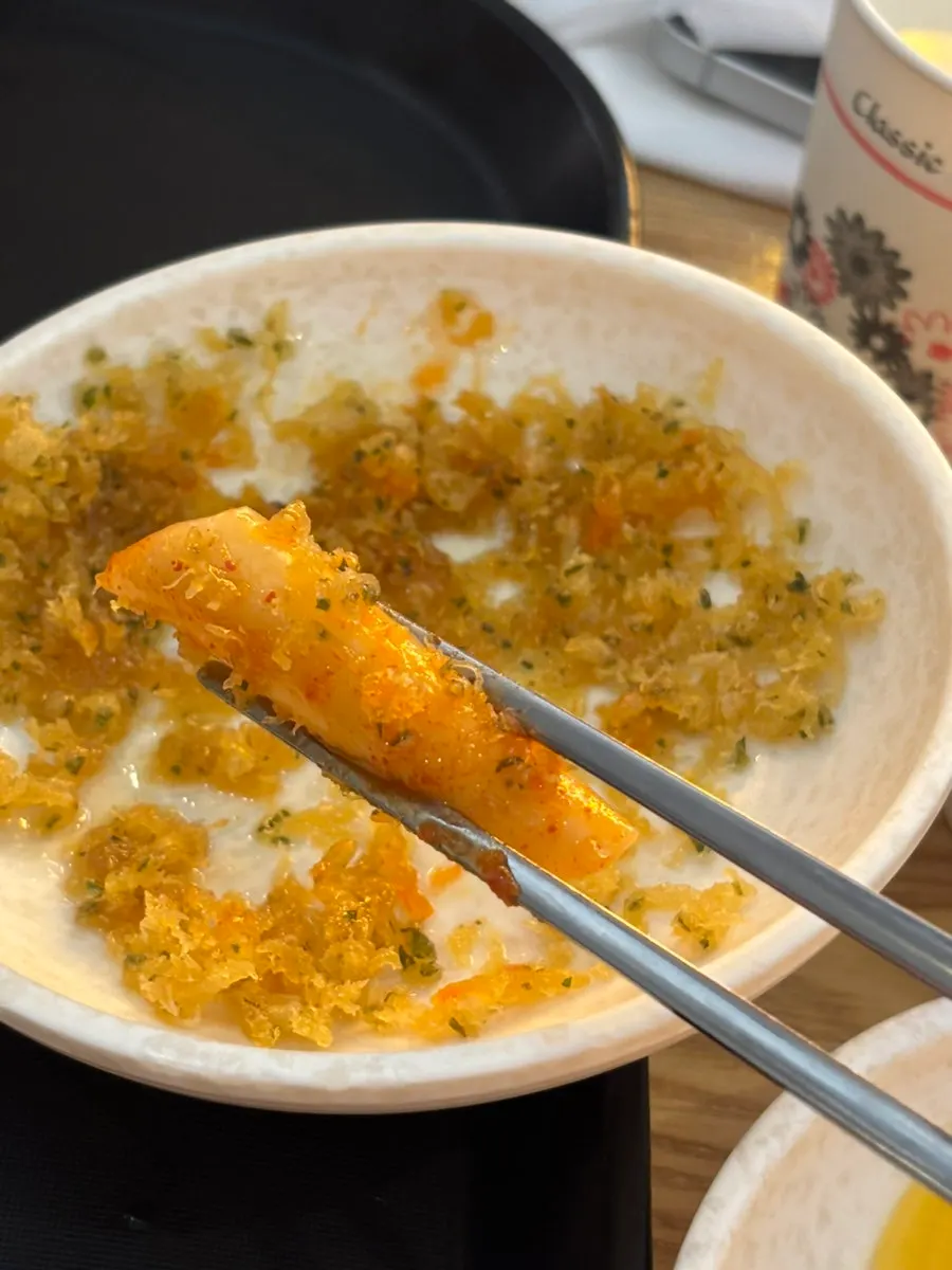 Fritter dipped into tteokbokki sauce