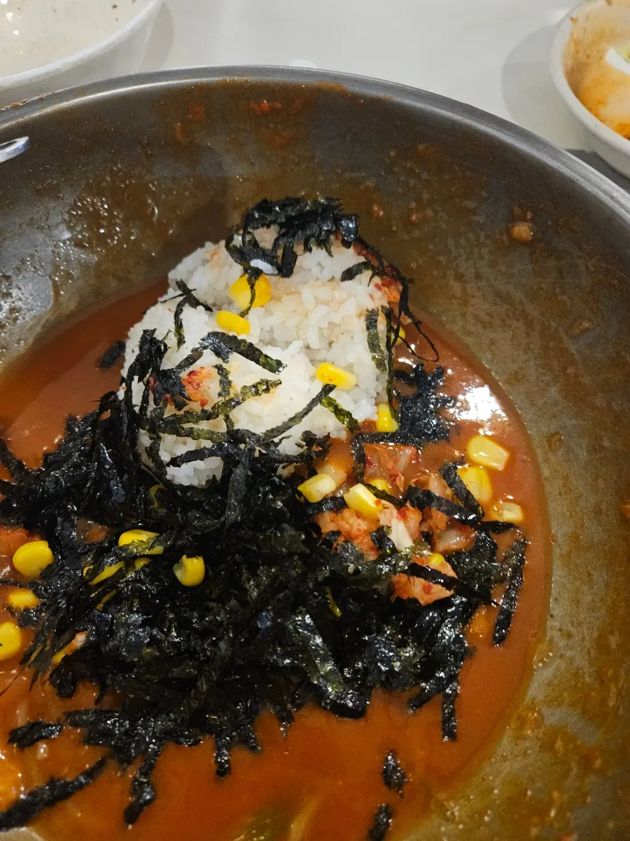 Fried rice ingredients before mixing into the tteokbokki broth
