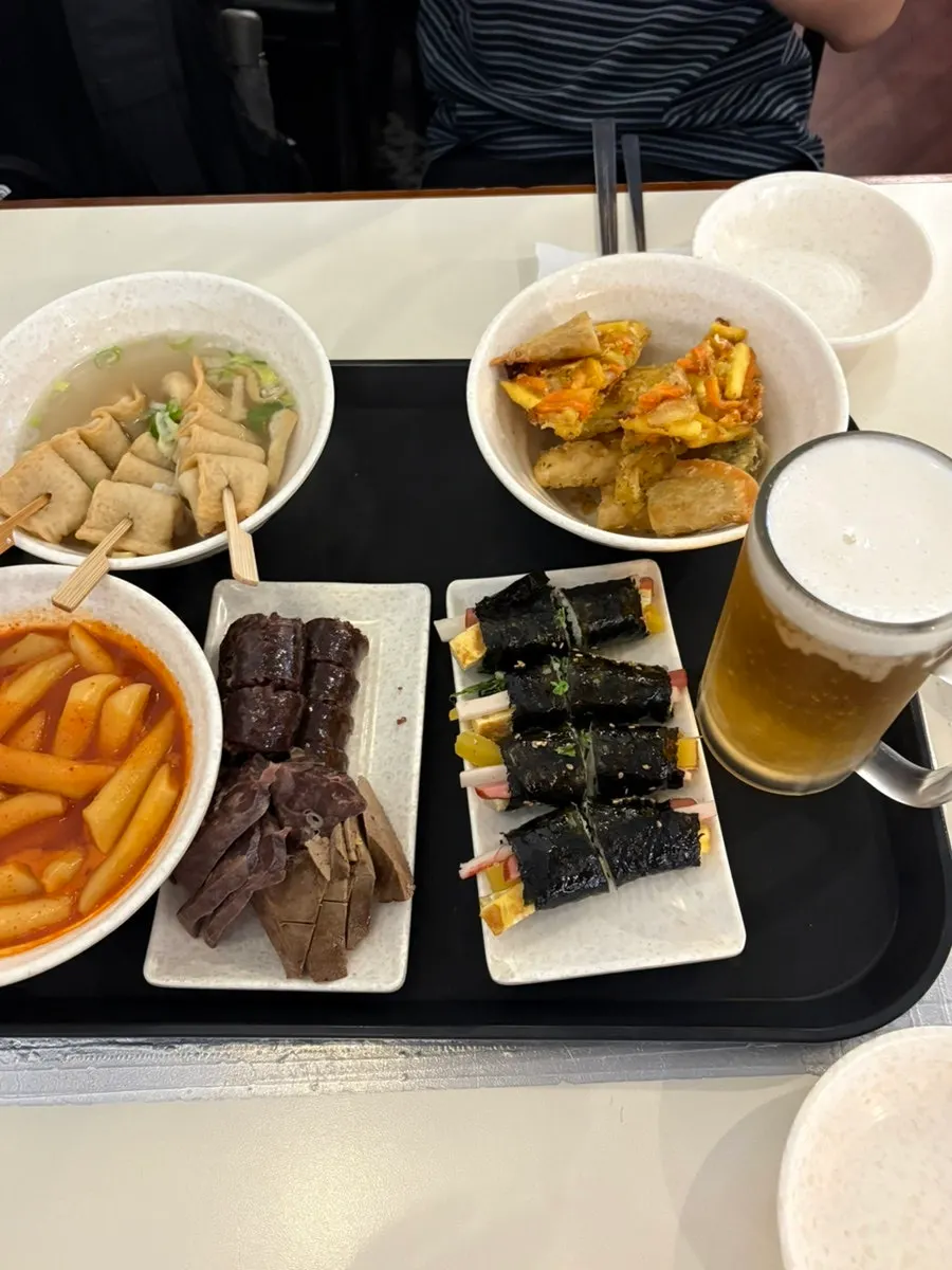 Close-up of medium-spice tteokbokki and mini gimbap
