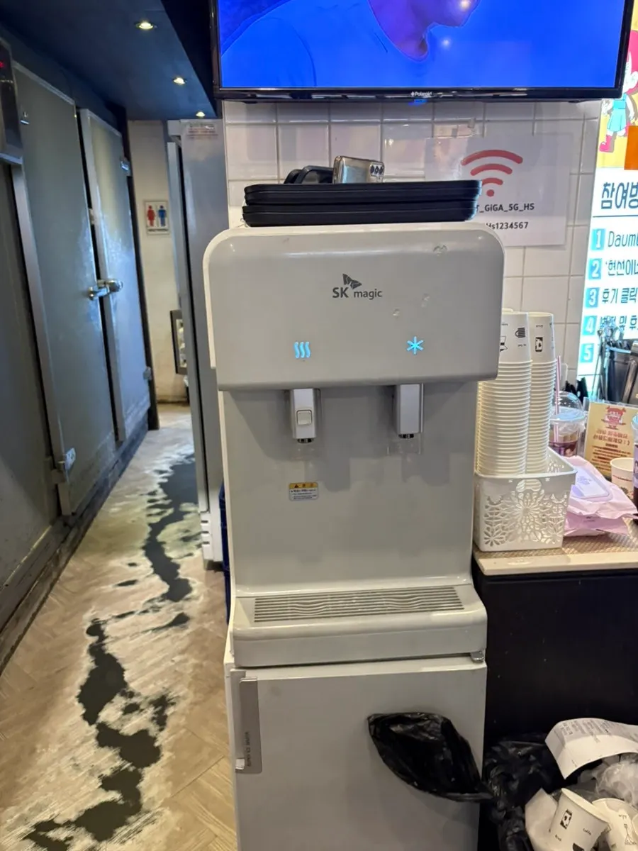 Water dispenser and self-serve cups at Hyeonseonine Yongsan Main Branch