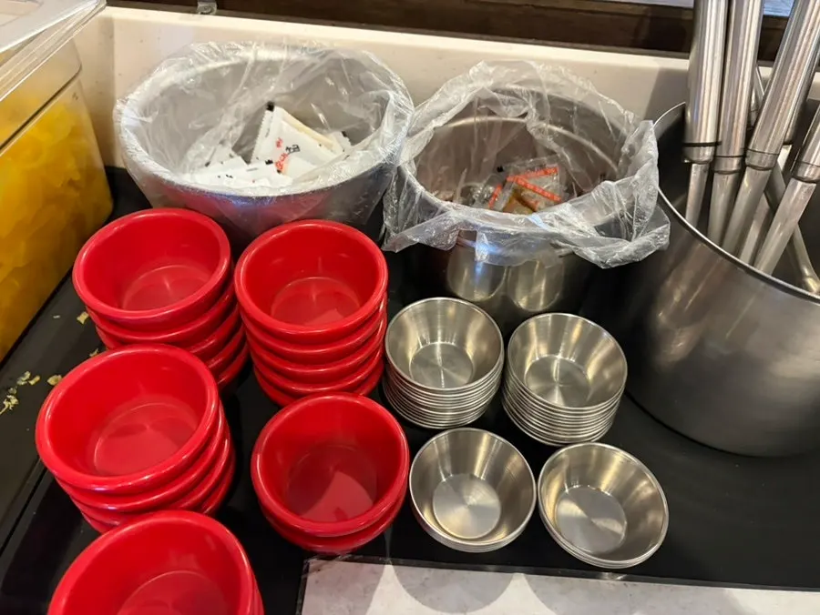 Self-serve fried batter flakes for dipping in tteokbokki sauce
