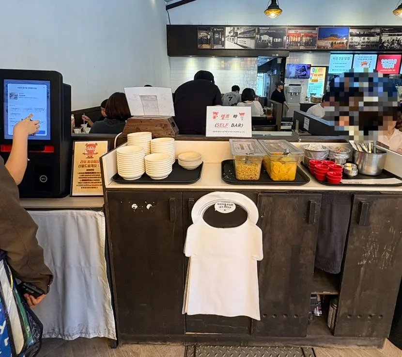 Hyeonseonine's self-serve bar with aprons and small plates