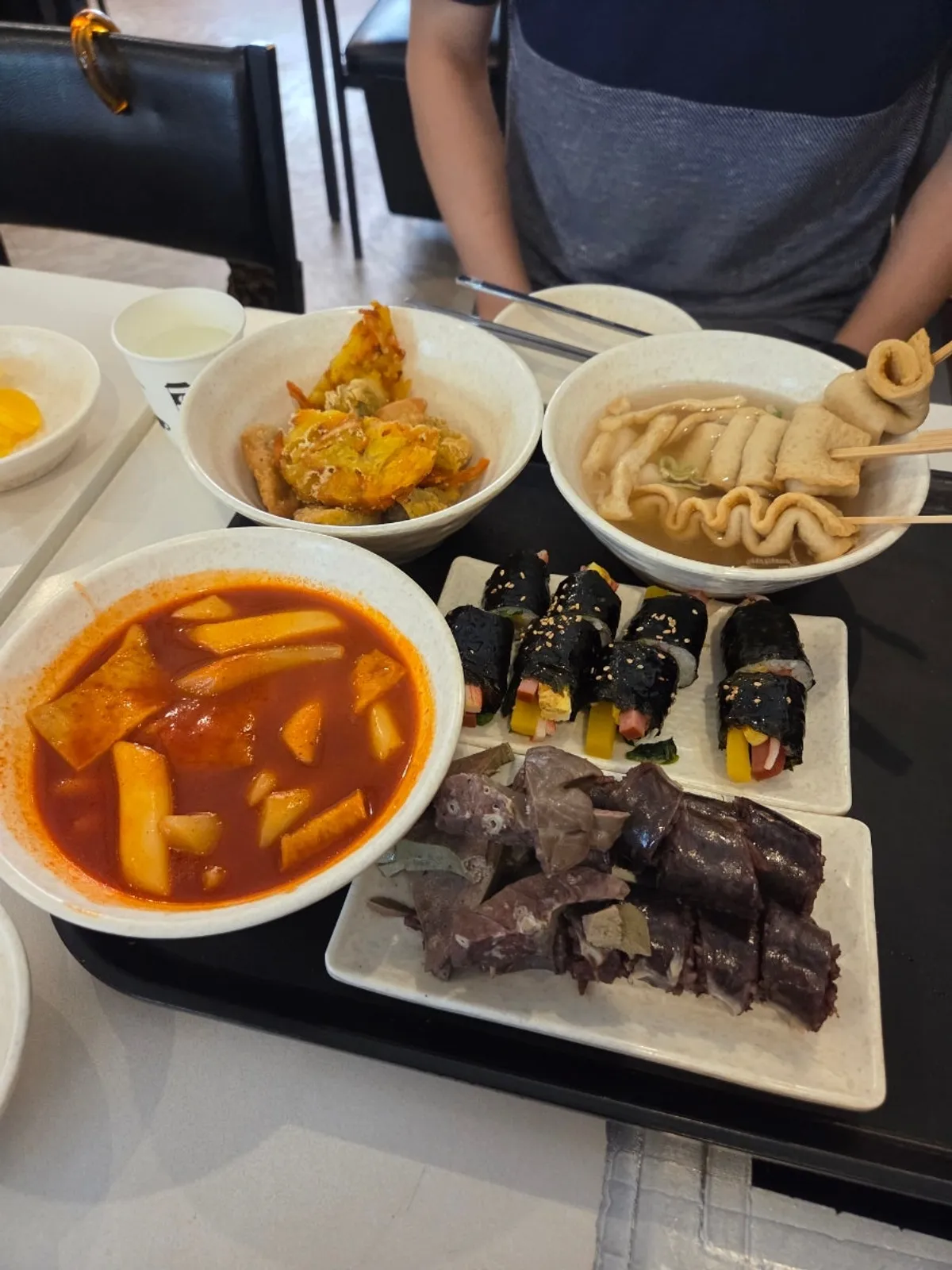 A full spread of instant tteokbokki at Hyeonseonine Yongsan Main Branch