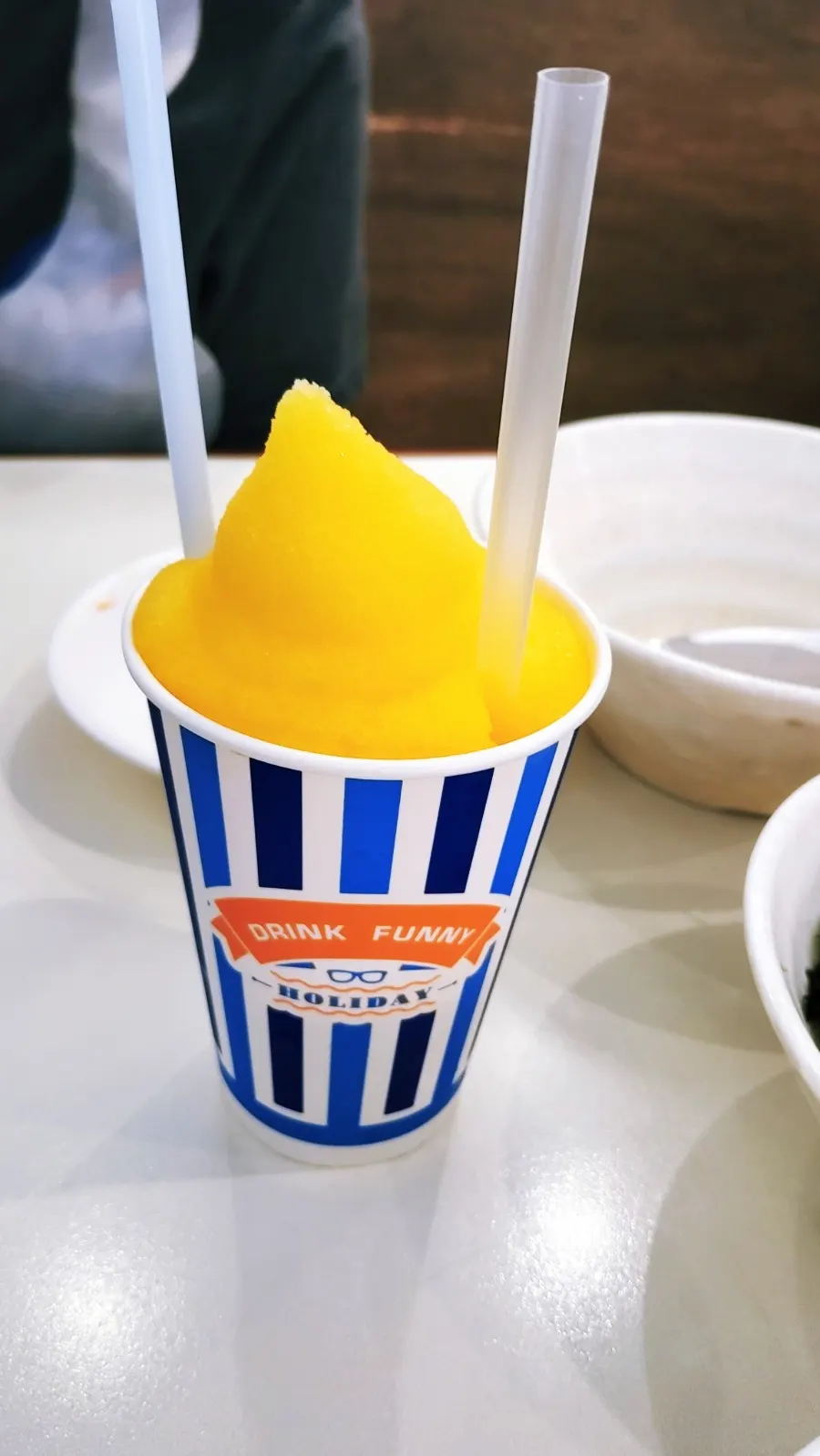 Cup of slushie next to the tteokbokki