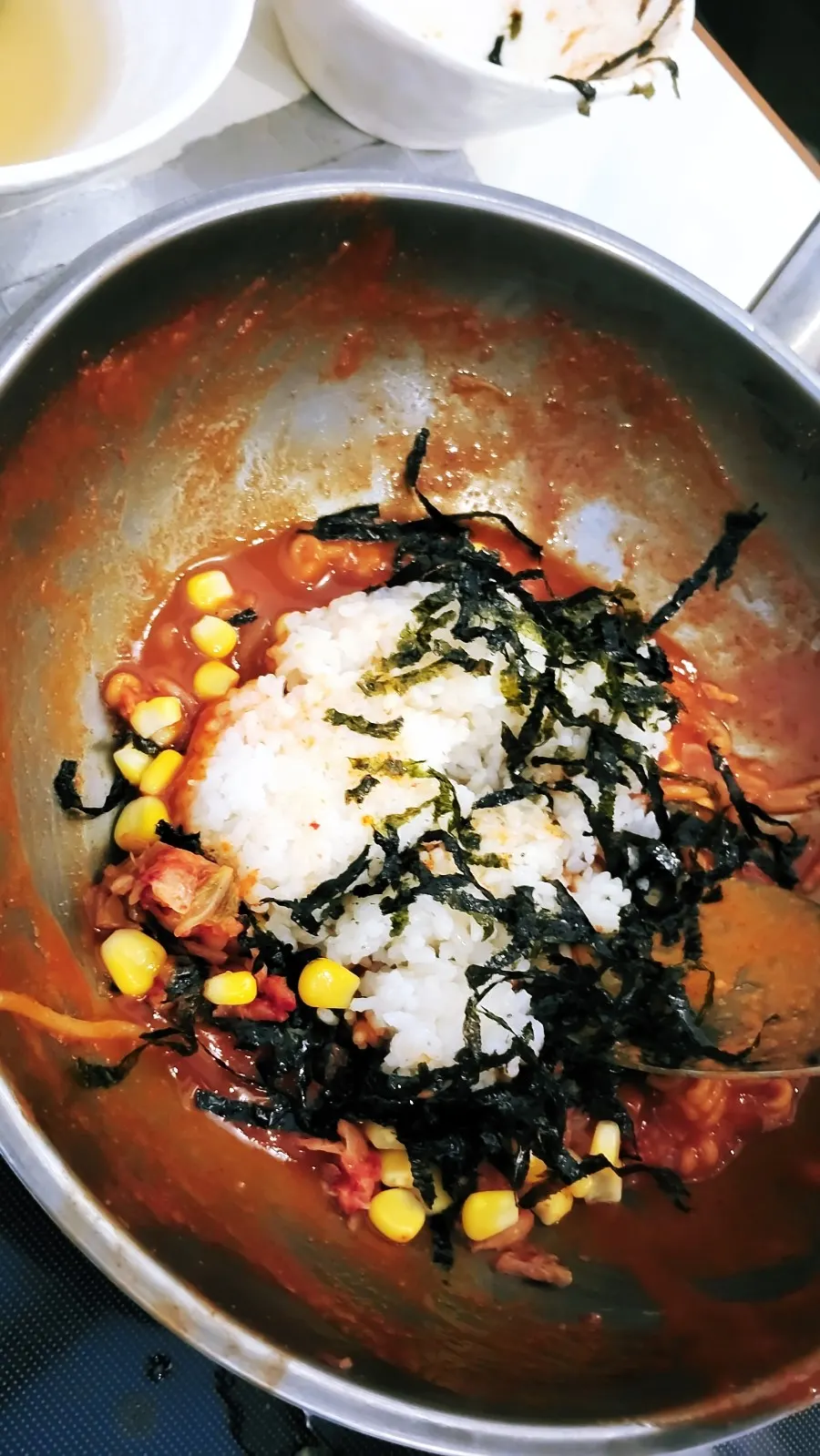Rice dropped into the leftover tteokbokki sauce