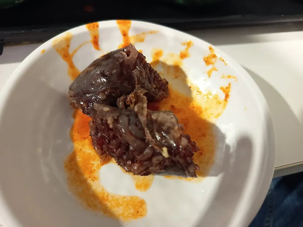 Sundae dipped in tteokbokki sauce