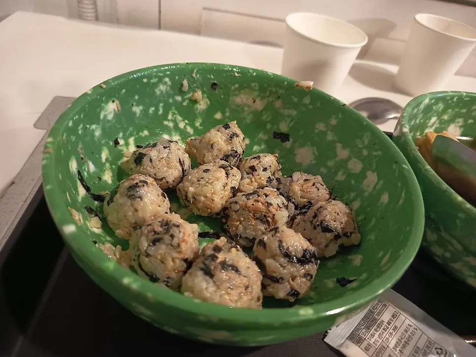 Cross-section of the rice ball with tuna and seaweed flakes