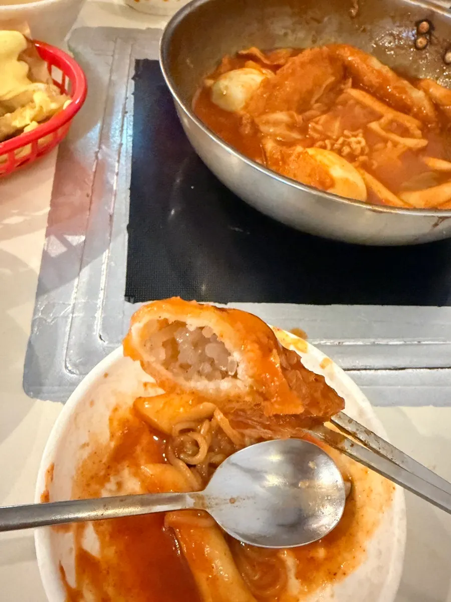 Full spread of instant tteokbokki and butter garlic fries