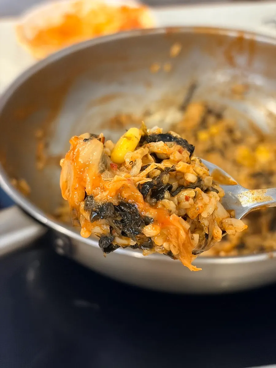 Self-frying rice in the leftover sauce