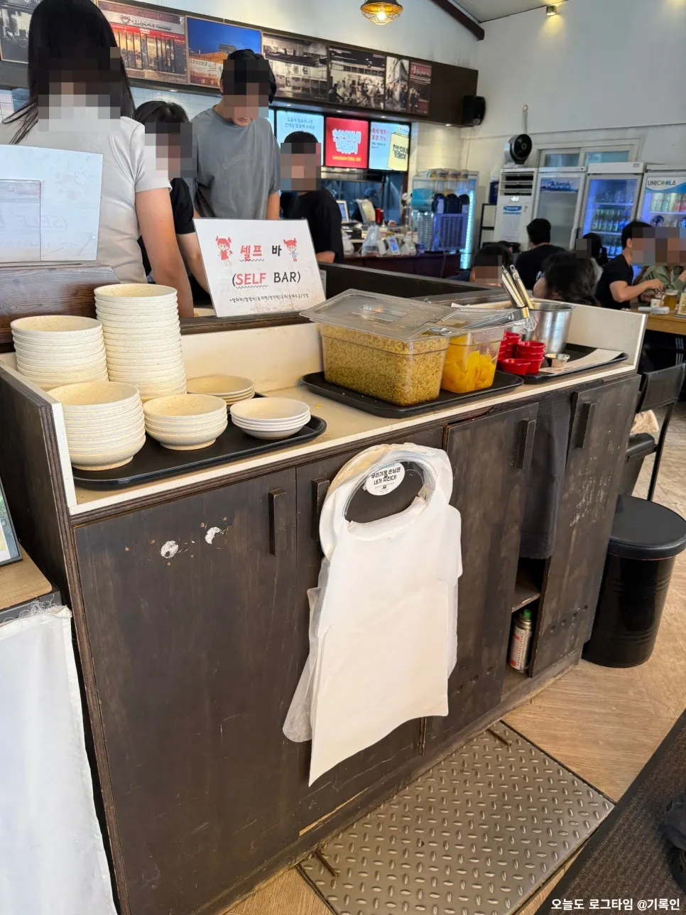 Self-serve bar with condiments and plates