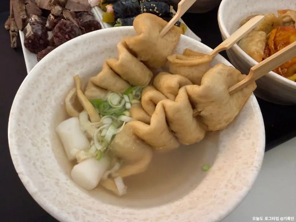 Three pieces of fish cake served with broth