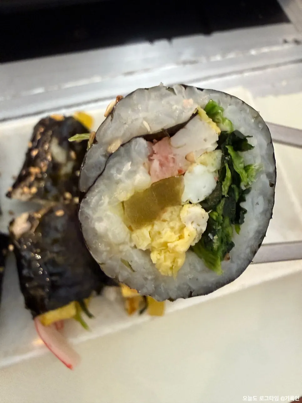 Cross-section of a substantial mini gimbap roll
