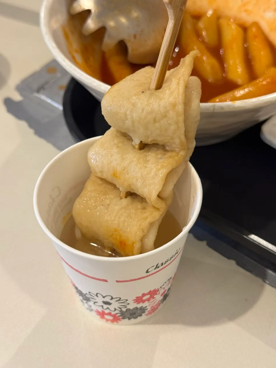 Scooping out a portion of tteokbokki