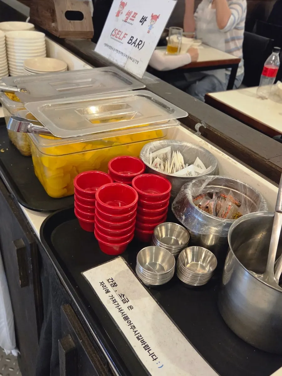 Self-serve bar with aprons and frying powder