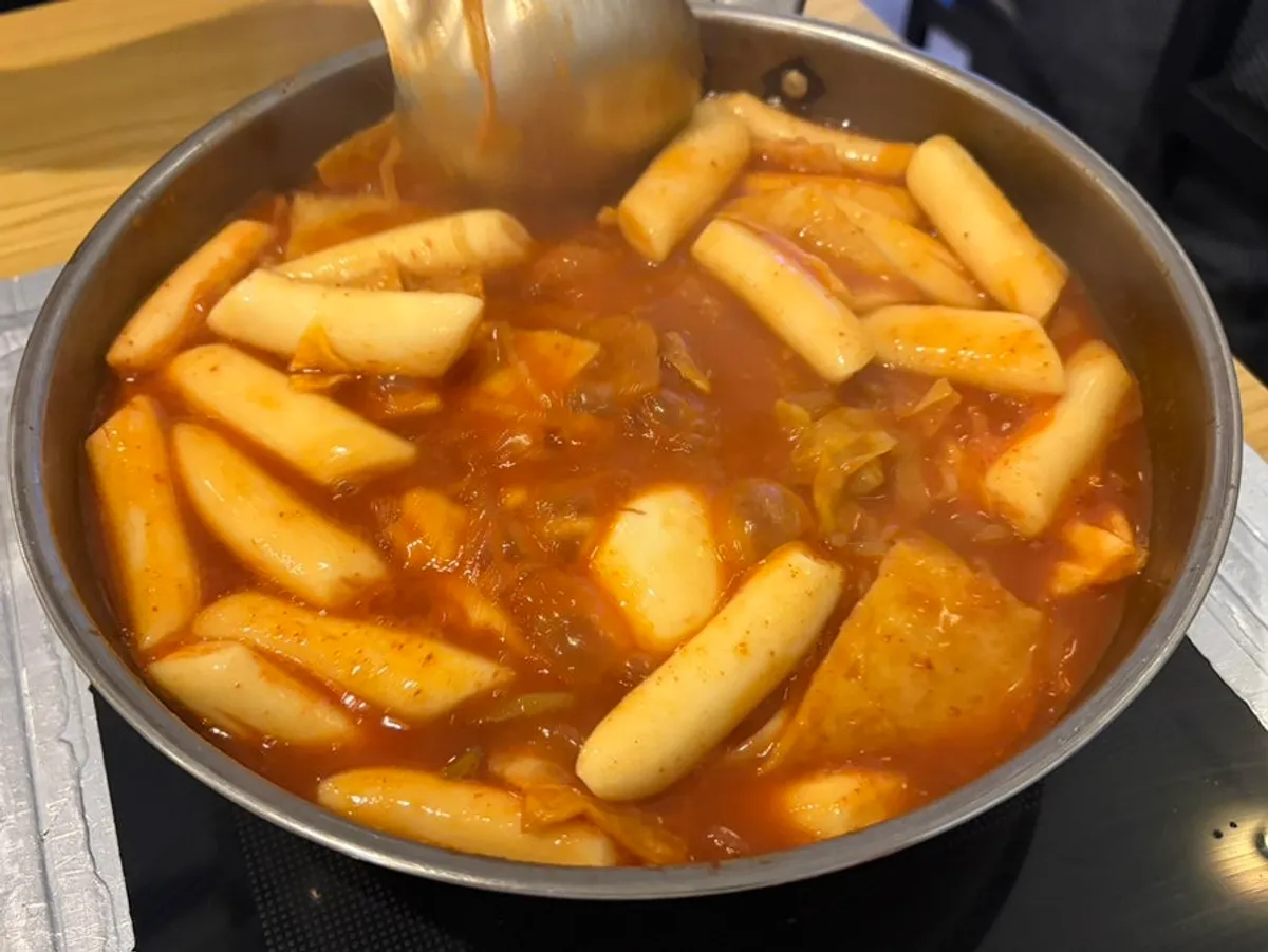 Instant tteokbokki and yakki-mandu spread at Hyeonseonine