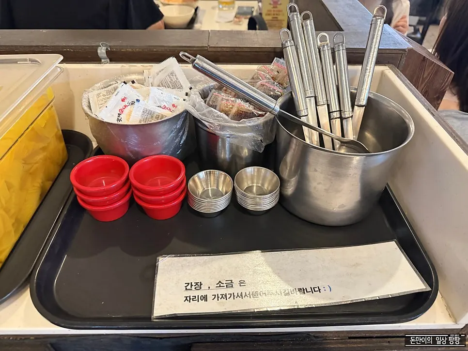 Self-serve bar with pickled radish and dishware