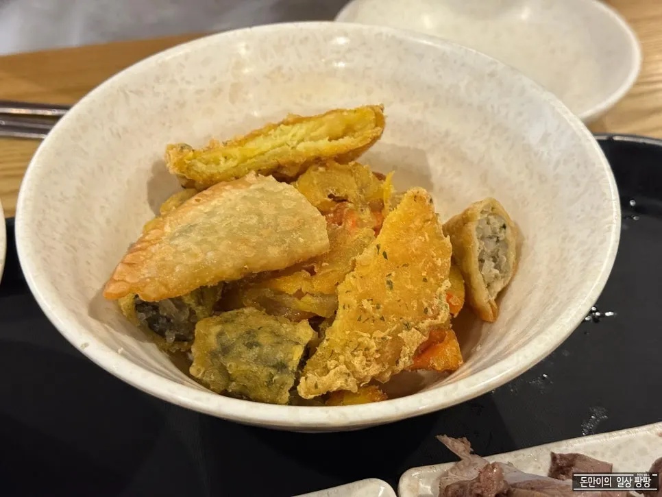 Three skewers of fish cake with fish cake broth