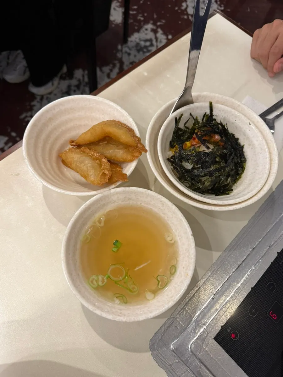 Table set with fish cake broth and fried rice ingredients