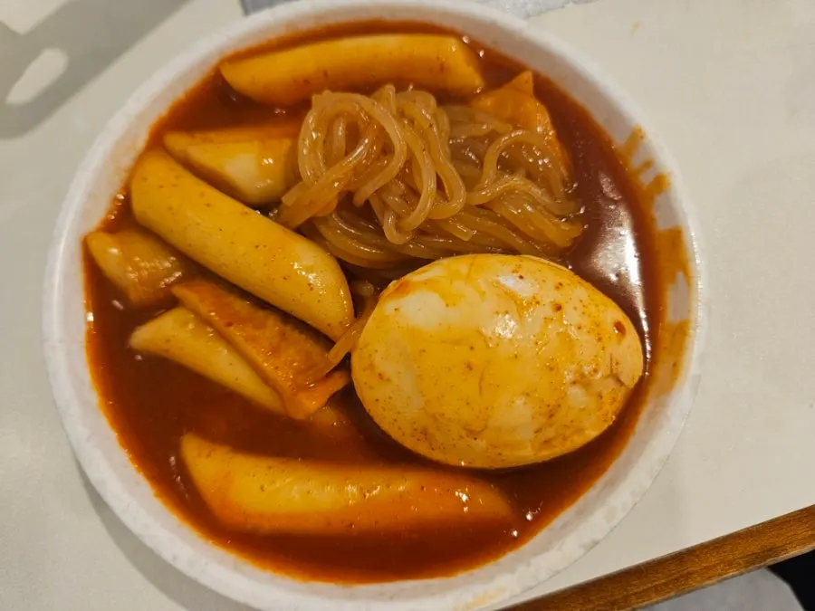 Chewy rice cakes lifted out of the instant tteokbokki
