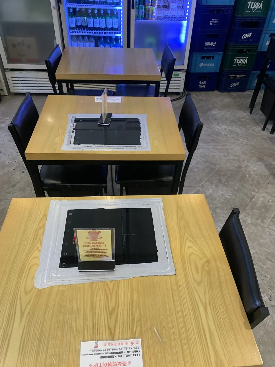 A row of tables fitted with induction stoves