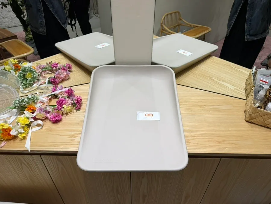 Diaper-changing table with disposable sheets