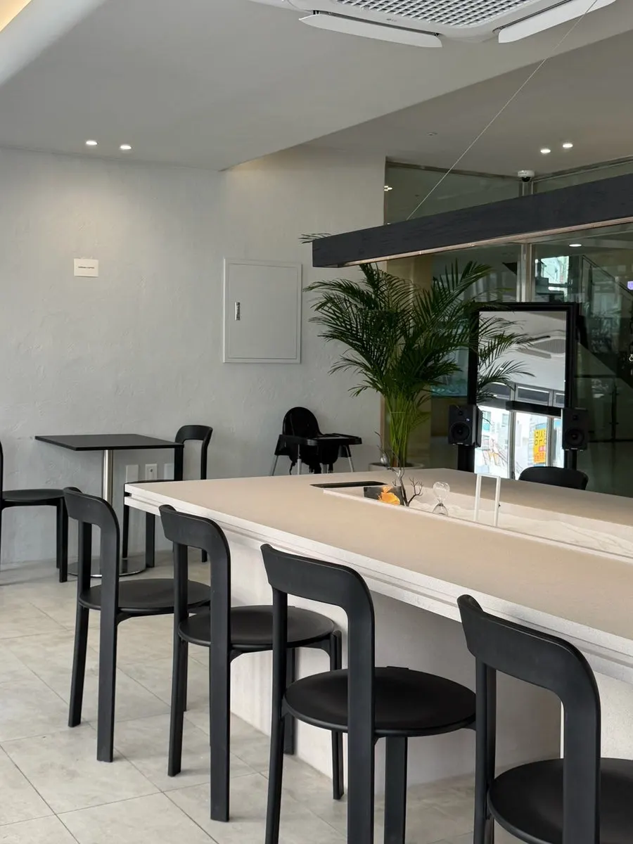 Café interior with a white base and black accents
