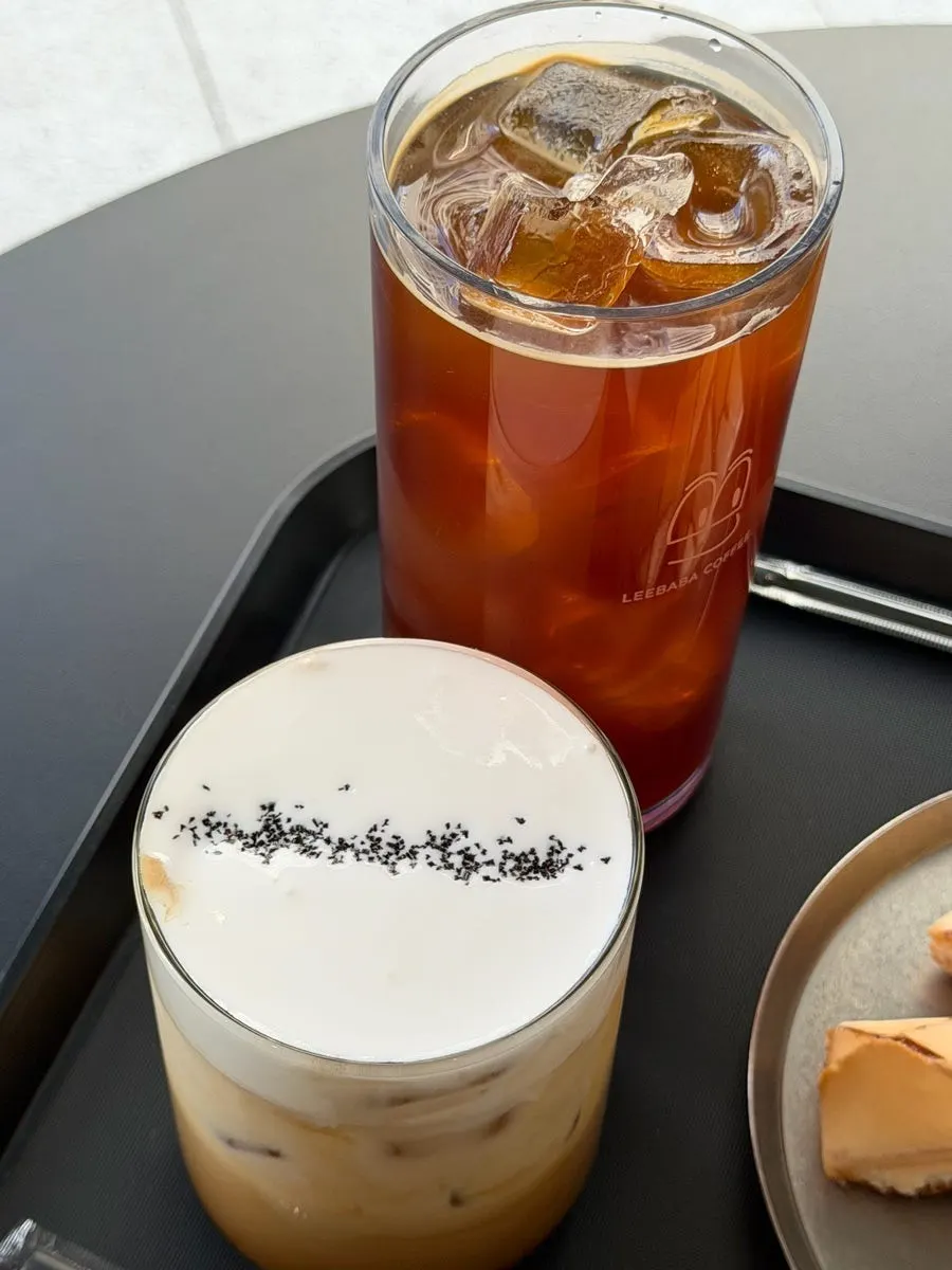 An Ibaba latte topped with cream