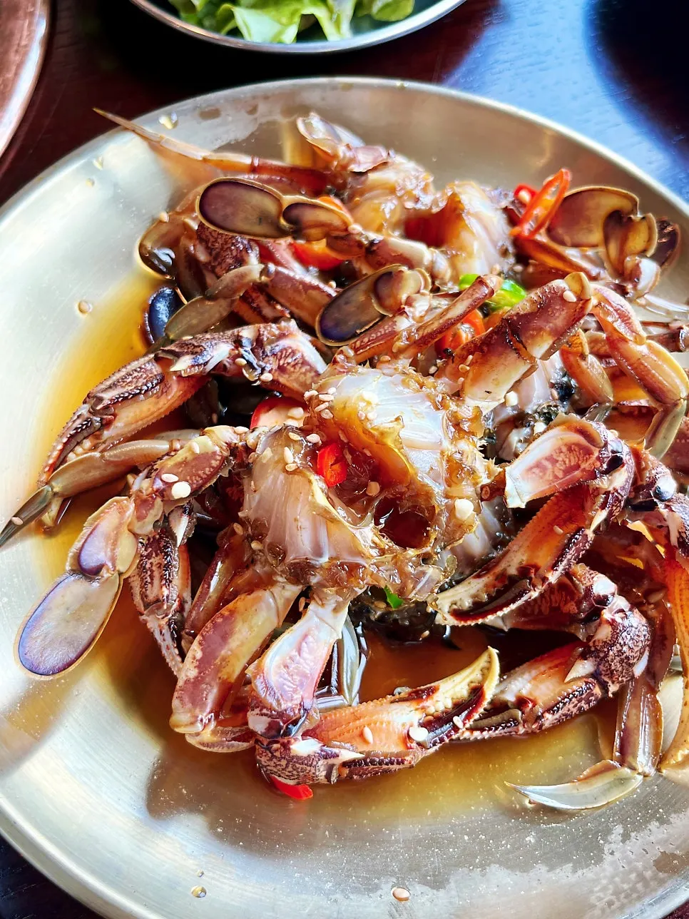 A plate with about four pieces of soy crab