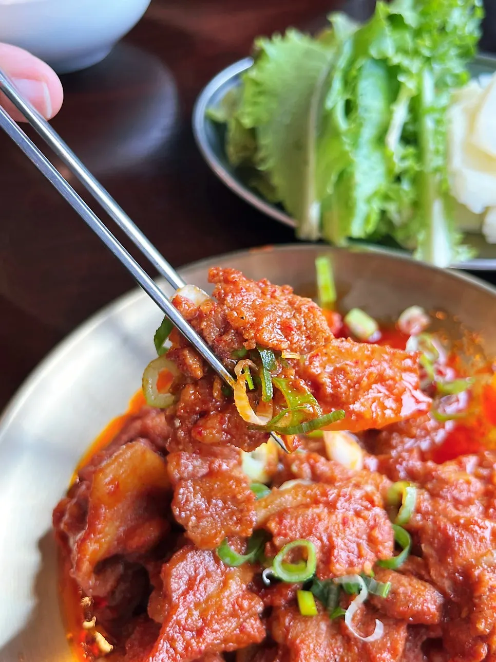Stir-fried pork served with lettuce wraps from the self-bar