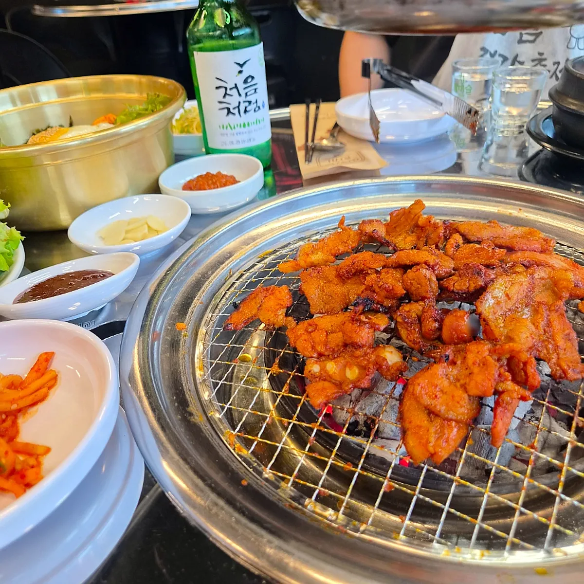 Spicy raw pork belly finished grilling with charcoal aroma
