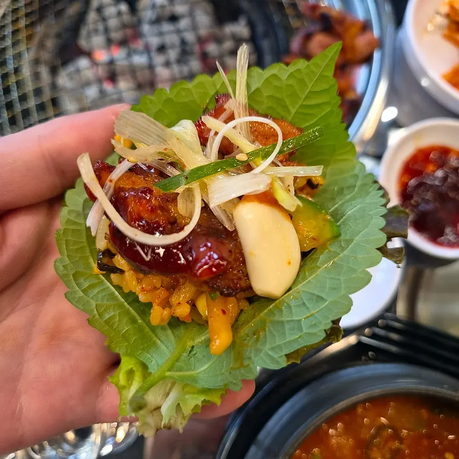 Meat wrapped and combined into a lettuce wrap