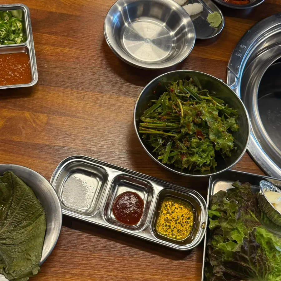 Self-service bar with kimchi and leafy wraps