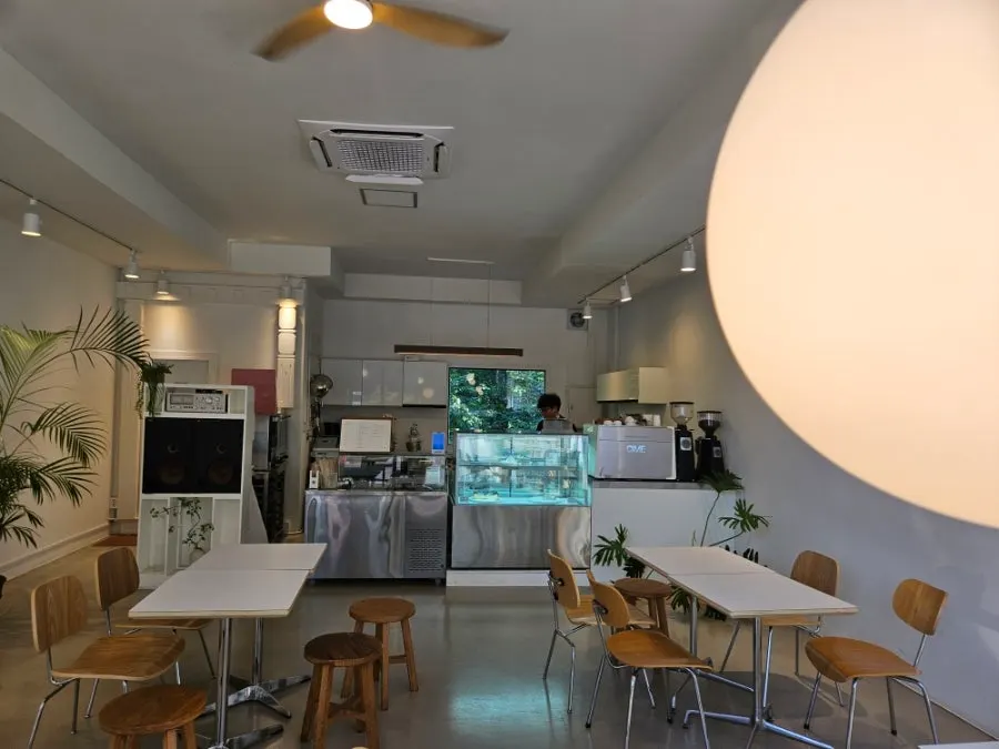 Café interior view connected to the open kitchen