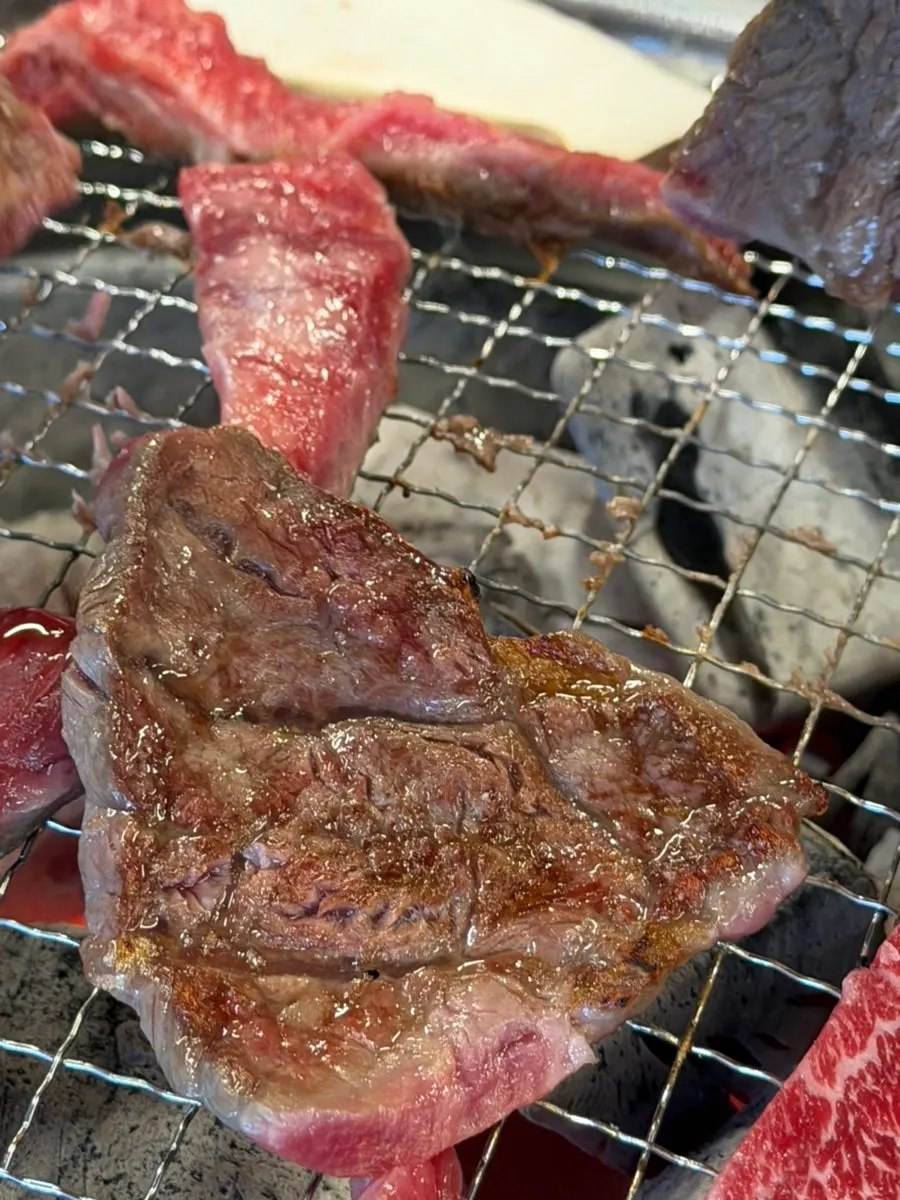 Jowatso's beef grilling over charcoal