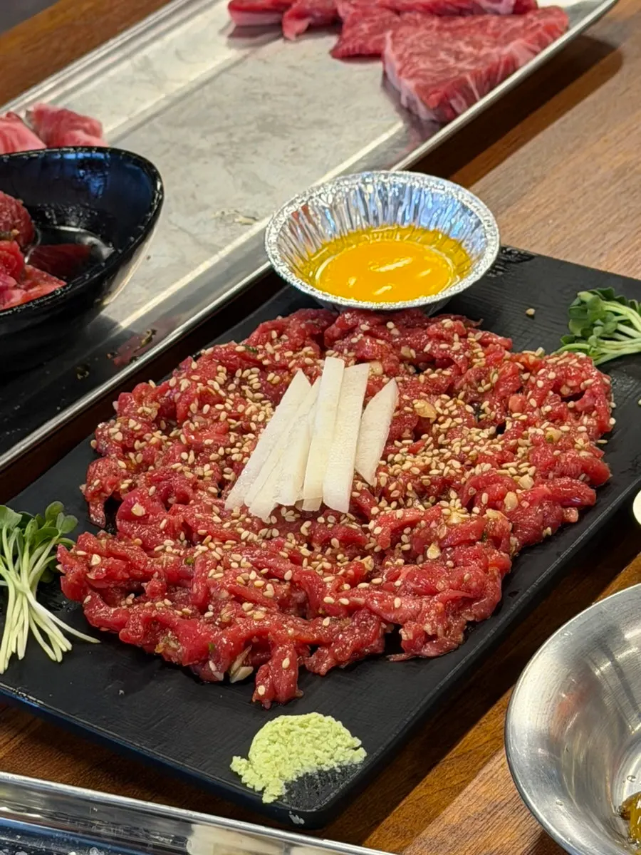 Jowatso's beef hoe topped with egg yolk