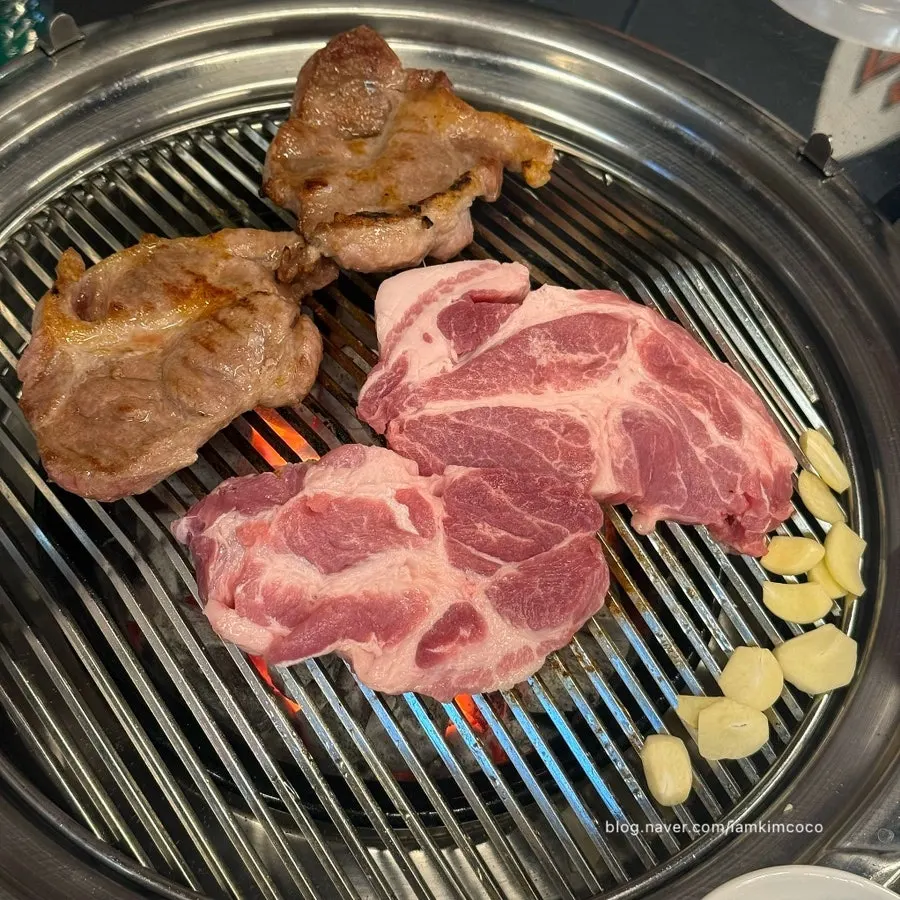 Fresh pork neck placed on the charcoal grill