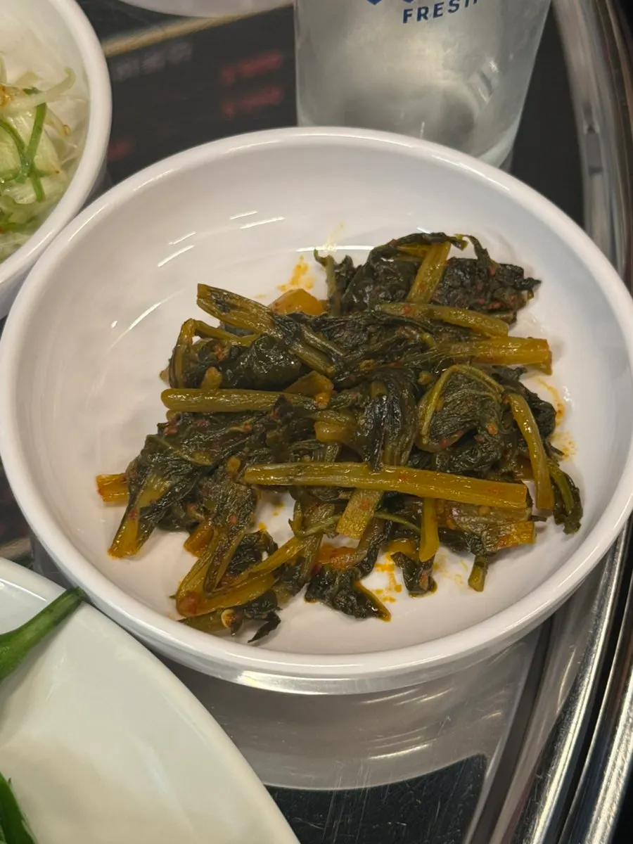 Generous portion of perilla leaves and lettuce for wraps