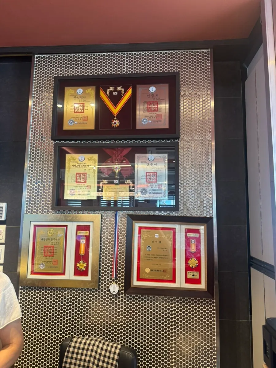 Korean-food master certificates and plaques displayed at Neul Gogi Jip
