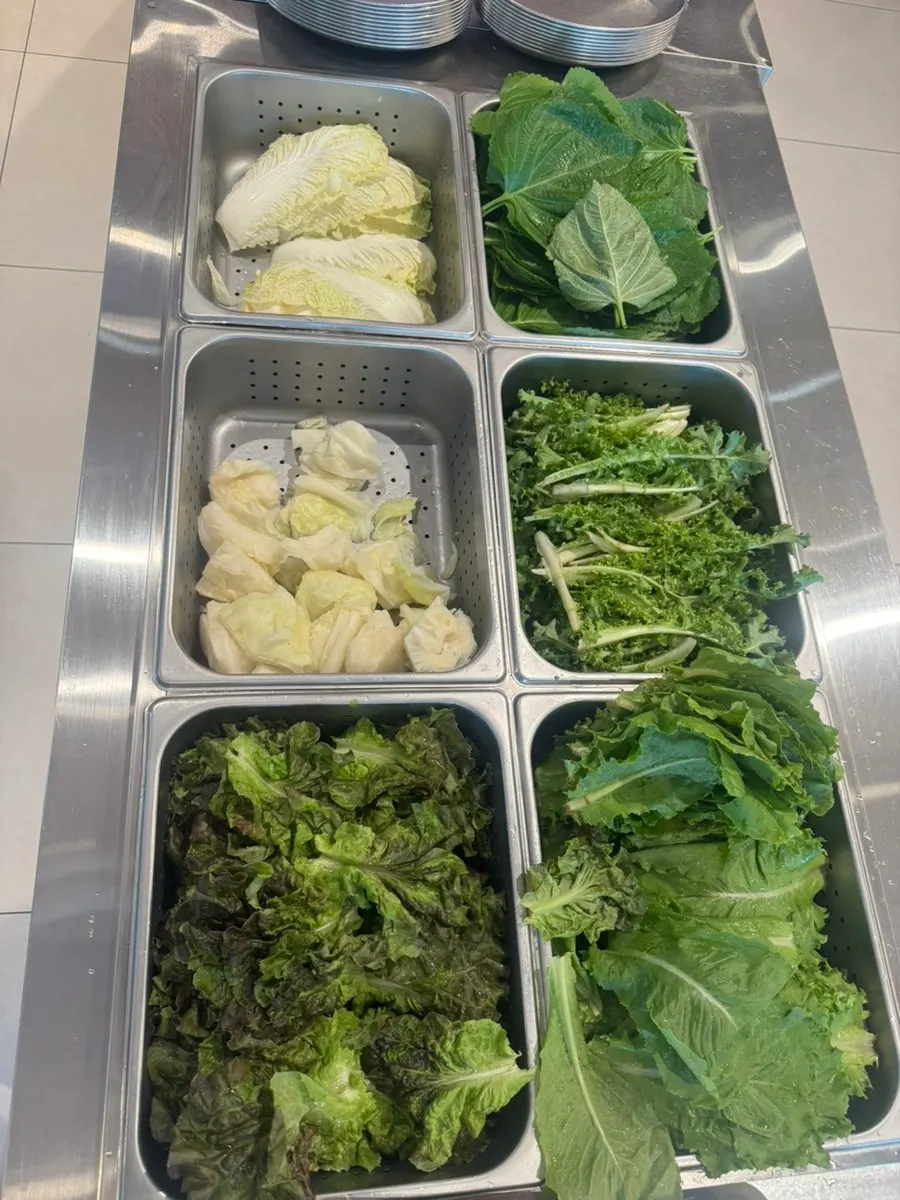 Fresh vegetables and greens on the self-serve bar