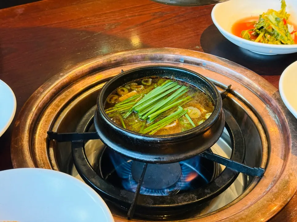 Doenjang stew broth with meat and beef tendon