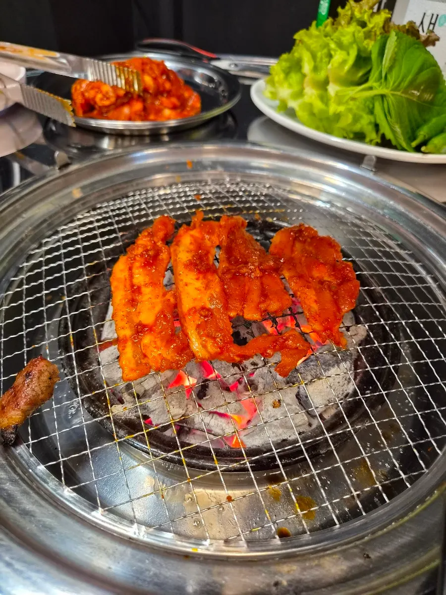 Thin slices of red seasoned pork belly