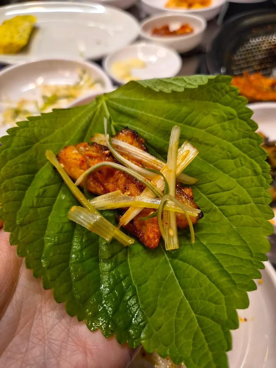 Close-up of fully cooked red fresh pork belly